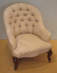 Antique button back armchair