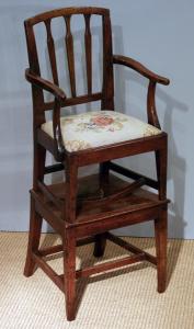 Antique child’s chair on stand